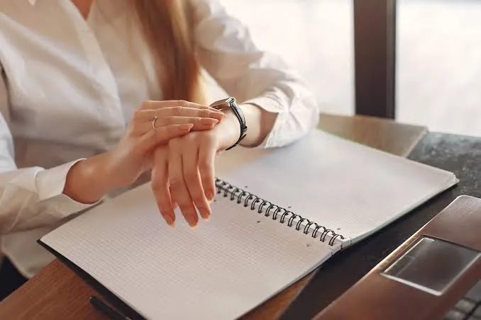 Planner and creative tools on a studio desk